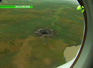 Illustration for article titled New video of mysterious giant Siberian hole filmed by investigation team
